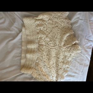 Cream high waisted shorts.